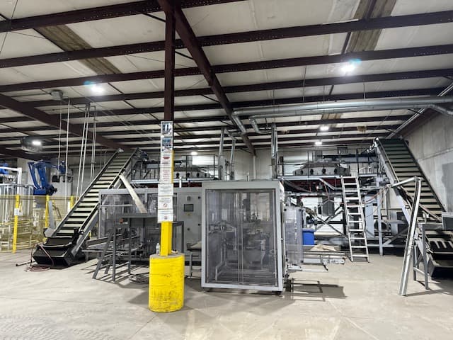 Two 2016 Eqraft 16-scale weighers with elevators, box fillers and feed conveyors